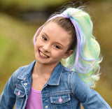 Girl wearing purple, pink, blue, yellow Unicorn hair extensions for little kids