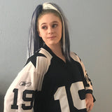 Girl wearing navy blue and white hair extensions 